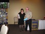 Past-President Sarah Lamothe gives a Paul Harris Fellowship award to Stu Lawrence